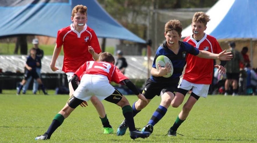 Boys playing rugby 