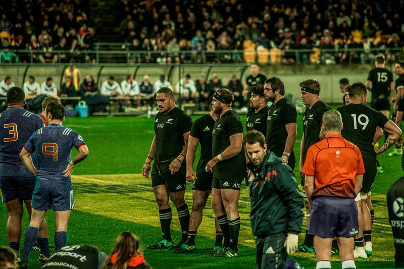 close up of all blacks rugby team before a scrum